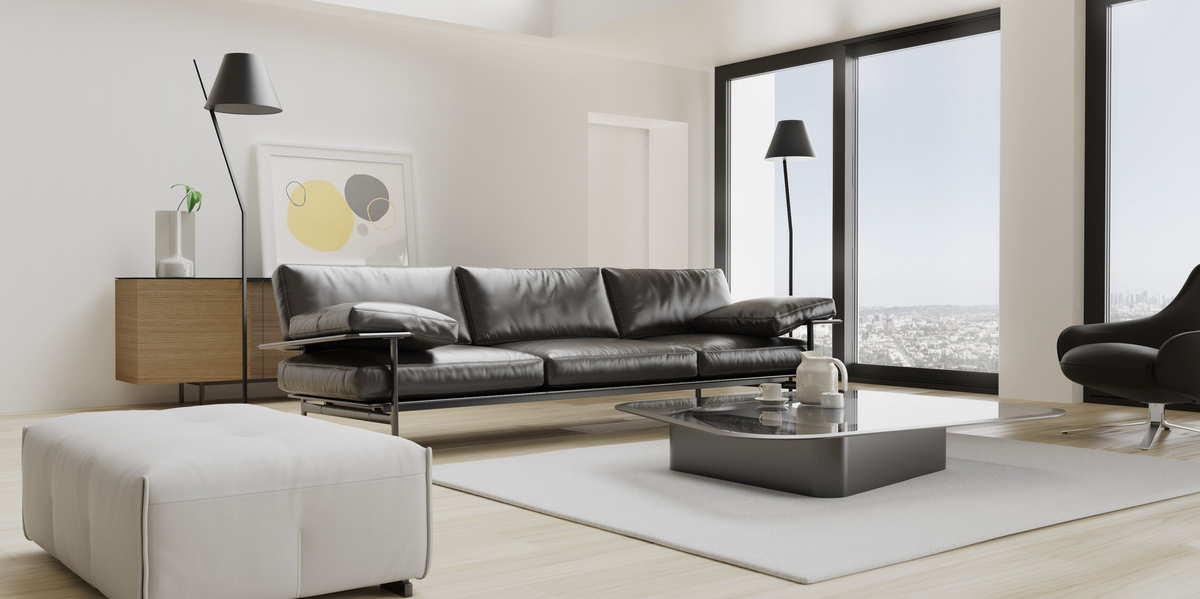 A living room with black leather furniture.