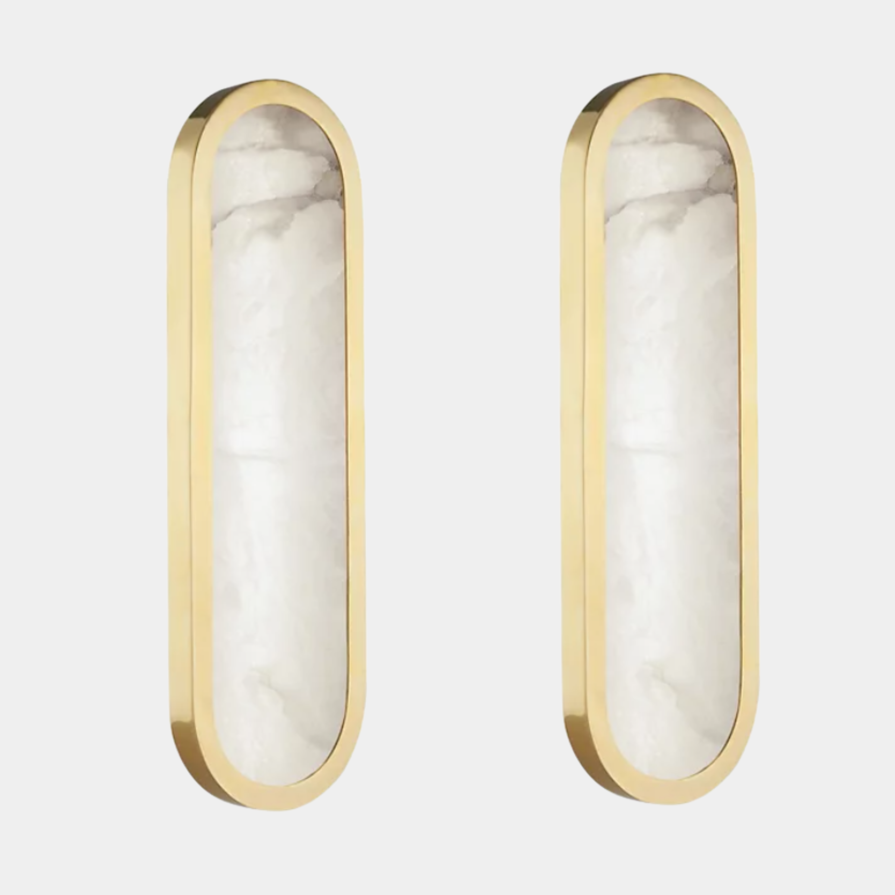 Two Hudson Valley Lighting Manhasset LED Wall Sconces (set of 2) with gold metal frames and frosted alabaster diffusers are mounted on a plain white wall.