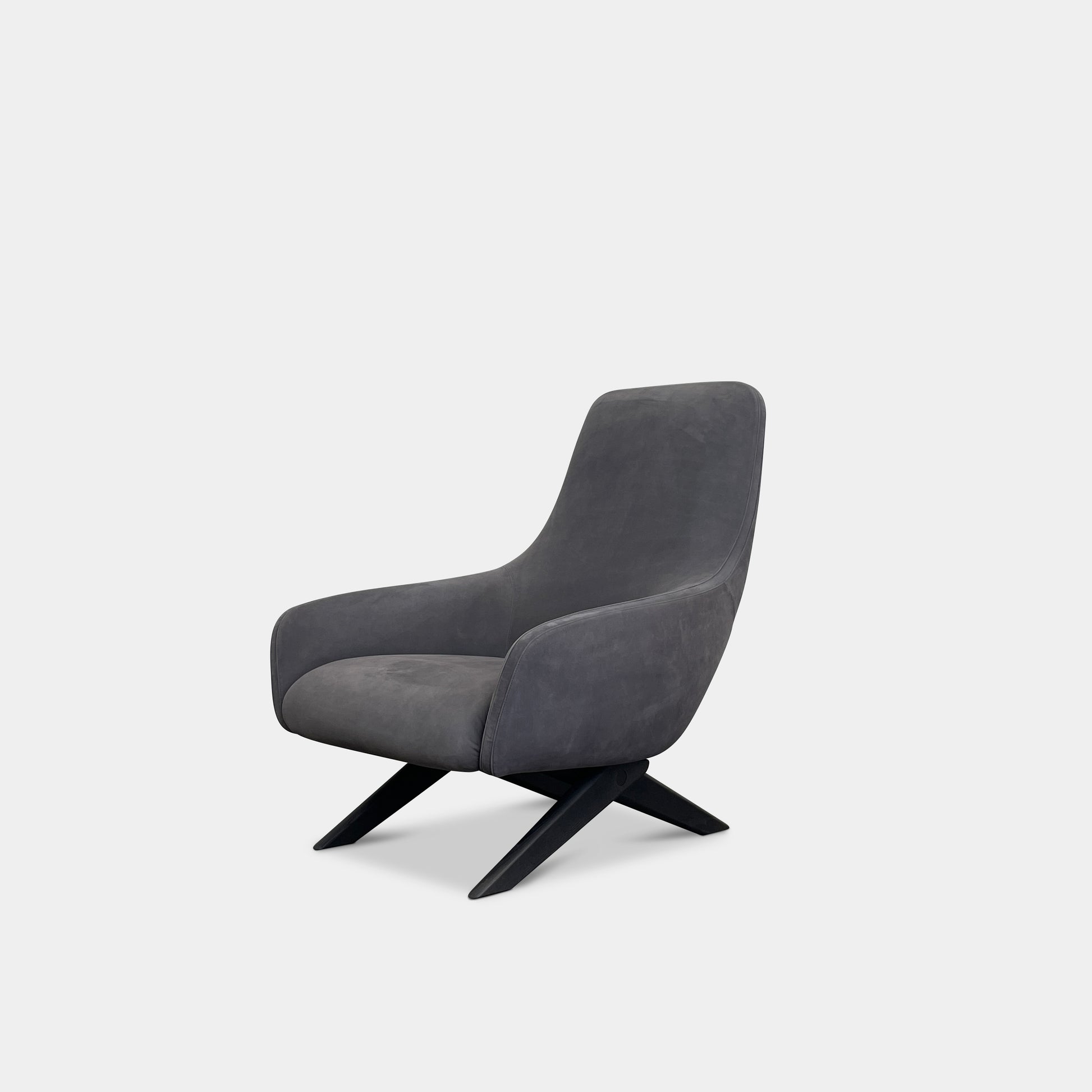 The Poliform Marlon Armchair, featuring a gray finish and sleek, angled wooden legs, exudes modern sophistication against a plain white background.