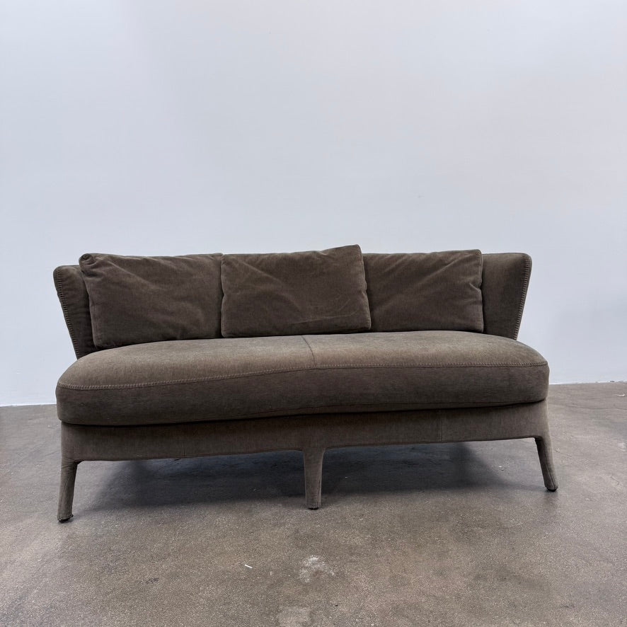 Small gray Maxalto Febo Small Sofa with a curved back, three back cushions, and visible stitched seams.