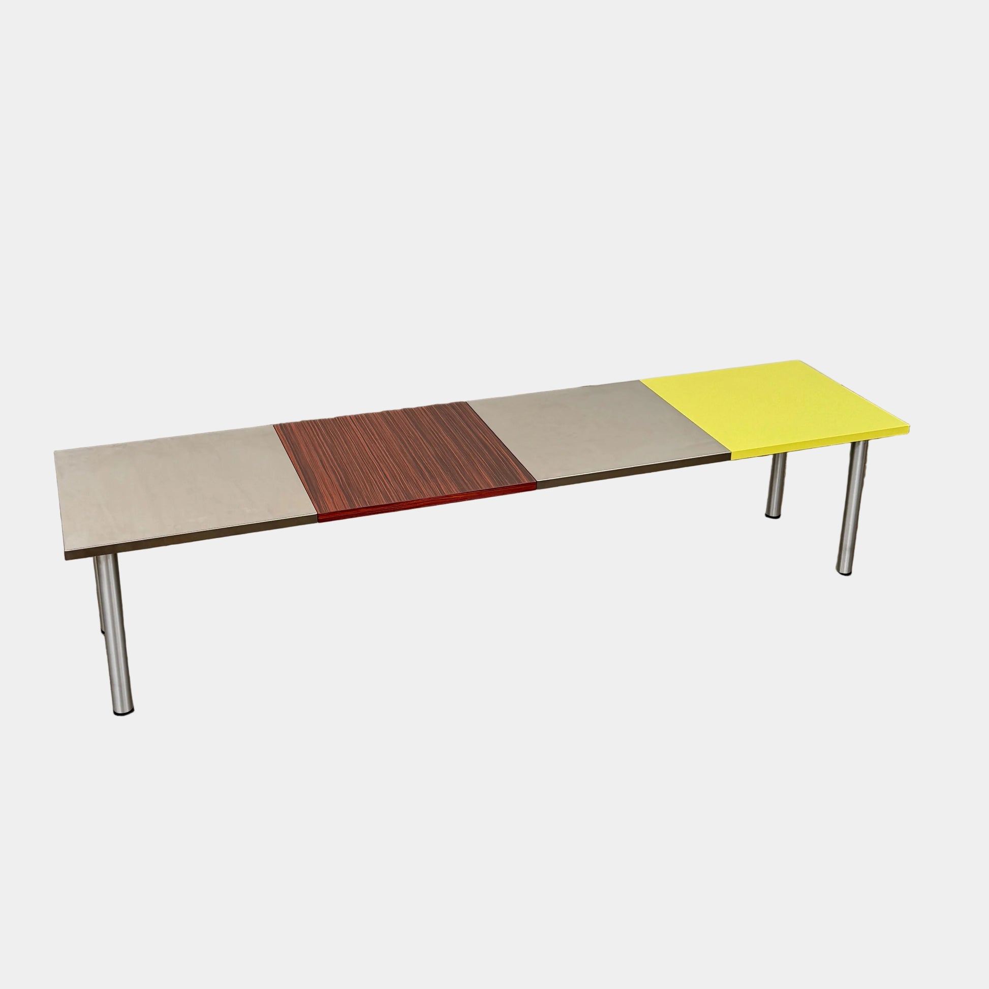 A Mazzei Multi-Panel Table with a contemporary design featuring yellow, orange, and blue stripes.