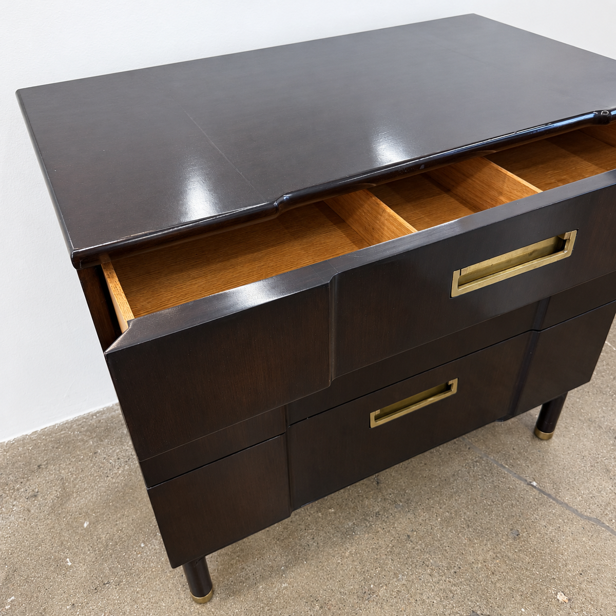 Vintage John Widdicomb Three Drawer Chest in dark wood, featuring three drawers with rectangular brass pulls and tapered legs.