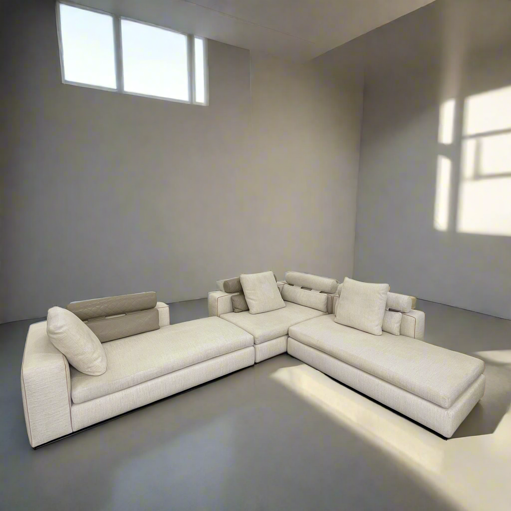 The Minotti Leonard 3 Piece Sectional by Minotti features an L-shaped beige design with three seat sections, multiple back and side cushions, and a right-side chaise lounge—ideal for an elegant living space—shown on a plain white background.