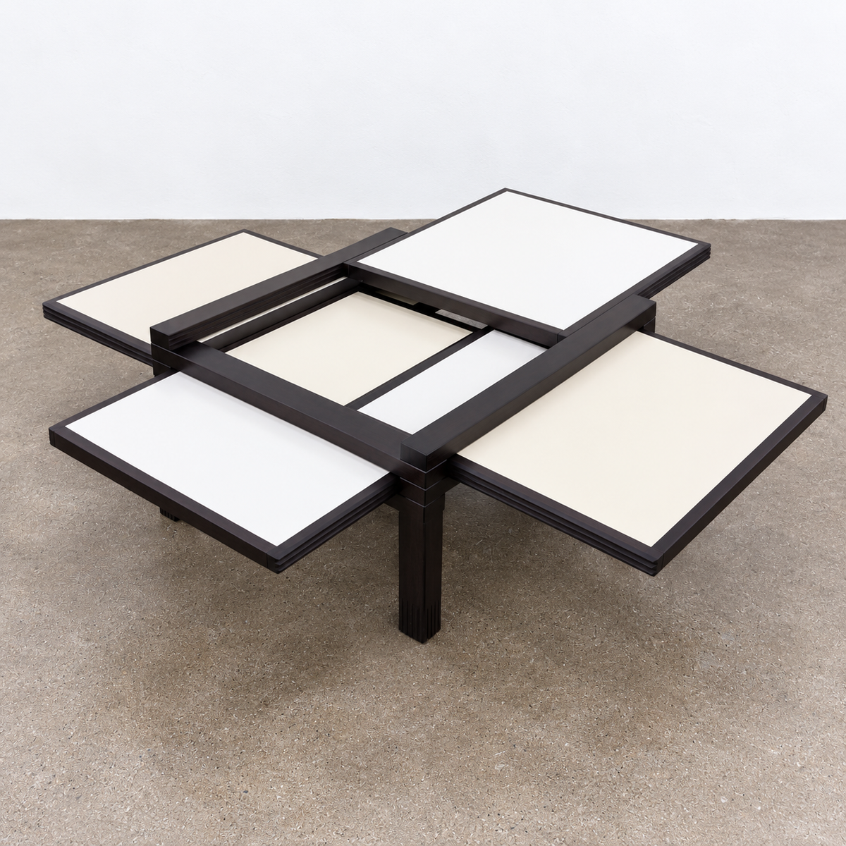 Bellato Hexa Expandable Coffee Table featuring an 1980s-style solid wood frame with multiple white and cream sliding panels extending from the center.