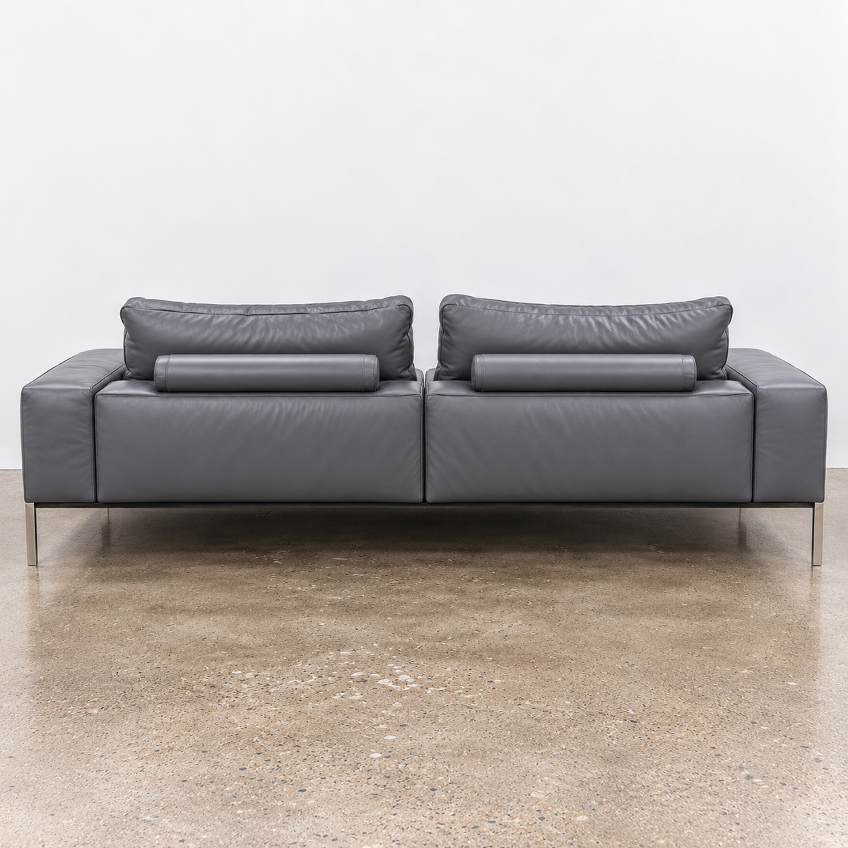 Flexform Lifesteel gray leather sofa on a thin metal frame with slender legs.
