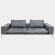 Flexform Lifesteel gray leather sofa on a thin metal frame with slender legs.