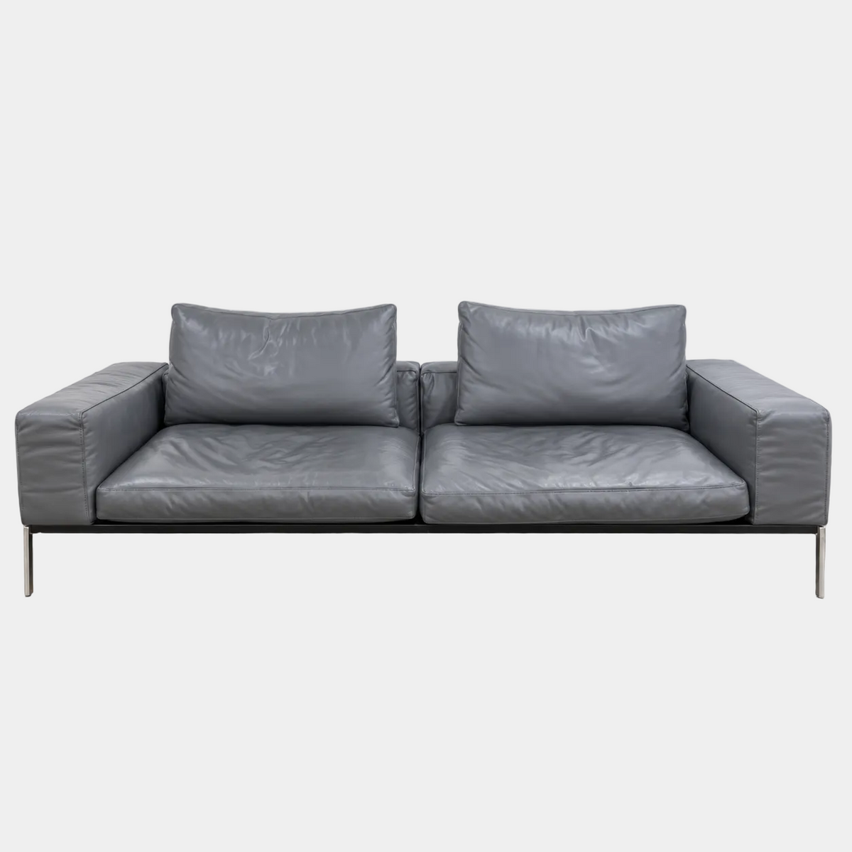 Flexform Lifesteel gray leather sofa on a thin metal frame with slender legs.