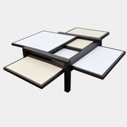 Bellato Hexa Expandable Coffee Table featuring an 1980s-style solid wood frame with multiple white and cream sliding panels extending from the center.