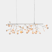 The Moooi Heracleum Endless LED Suspension Lamp-White is a modern chandelier featuring multiple radial branches ending in circular light diffusers, hanging from a single cord attached to a round ceiling mount.