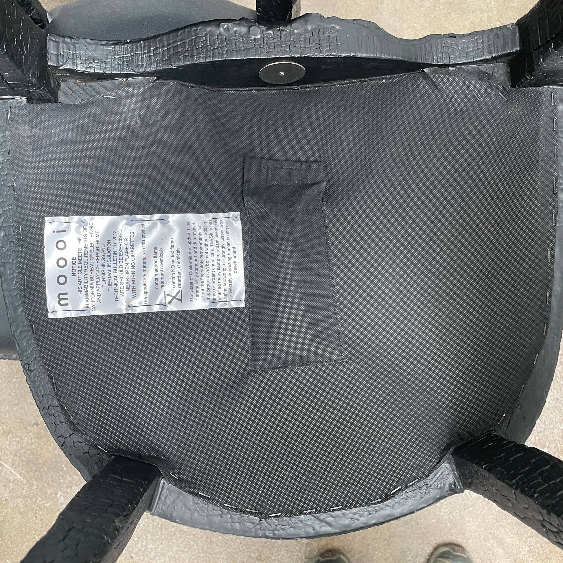 A set of seven Moooi Smoke Dining Side Chairs, crafted by Moooi in an ornate black finish with leather upholstery and cushioned seats and backs, arranged in two rows against a plain white background.