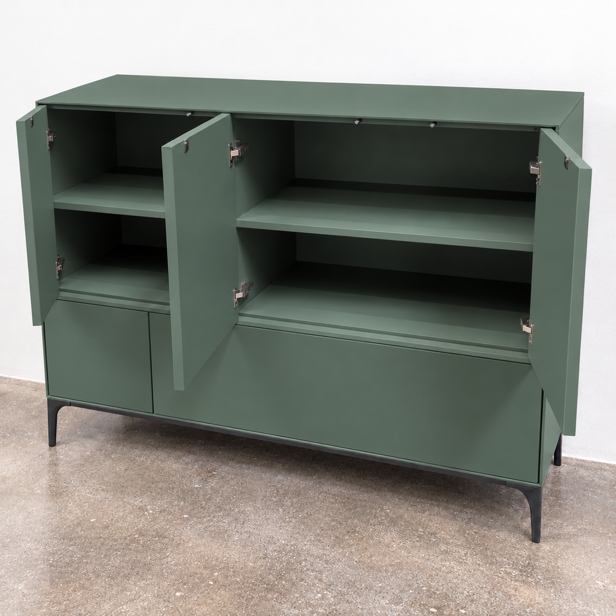 A sage green Treku Lauki cabinet featuring five asymmetrical doors and black metal legs in a contemporary design.