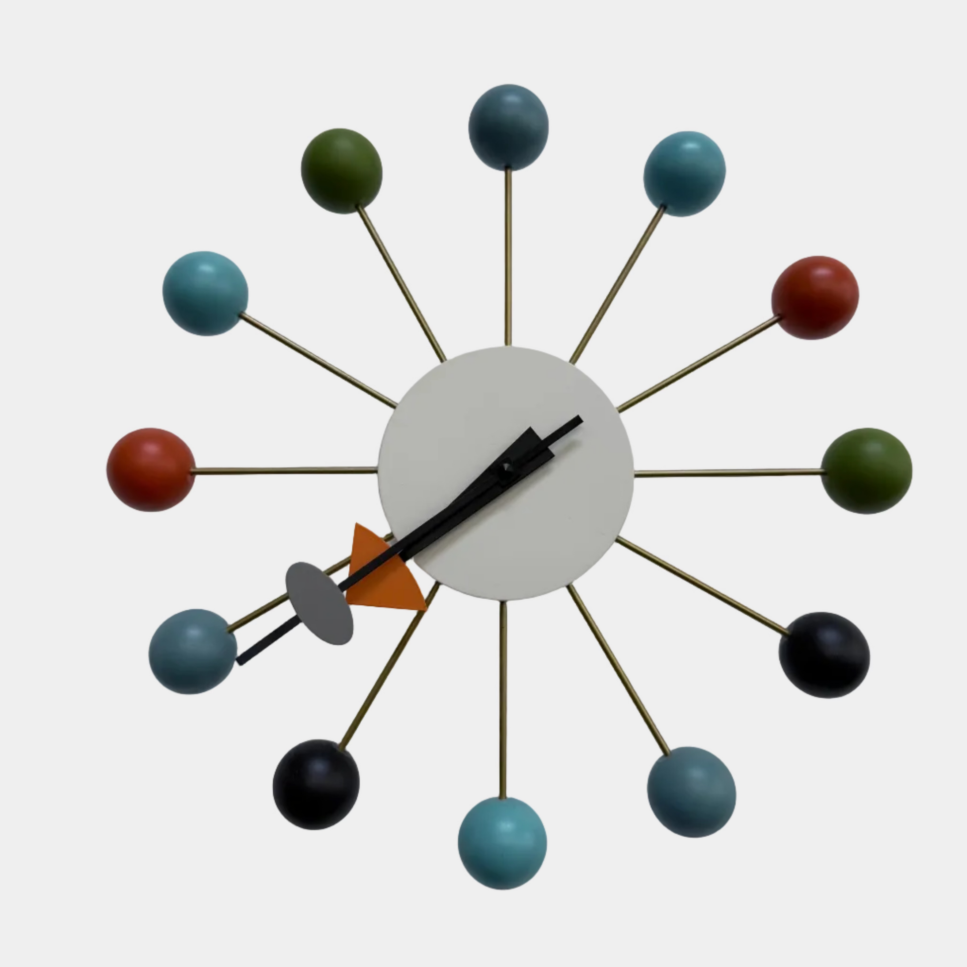 The Vitra Nelson Ball Clock - Multicolor by Vitra features a white circular face, multicolored ball hour markers, and sleek black hands, inspired by the classic mid-century modern Nelson Ball Clock design.