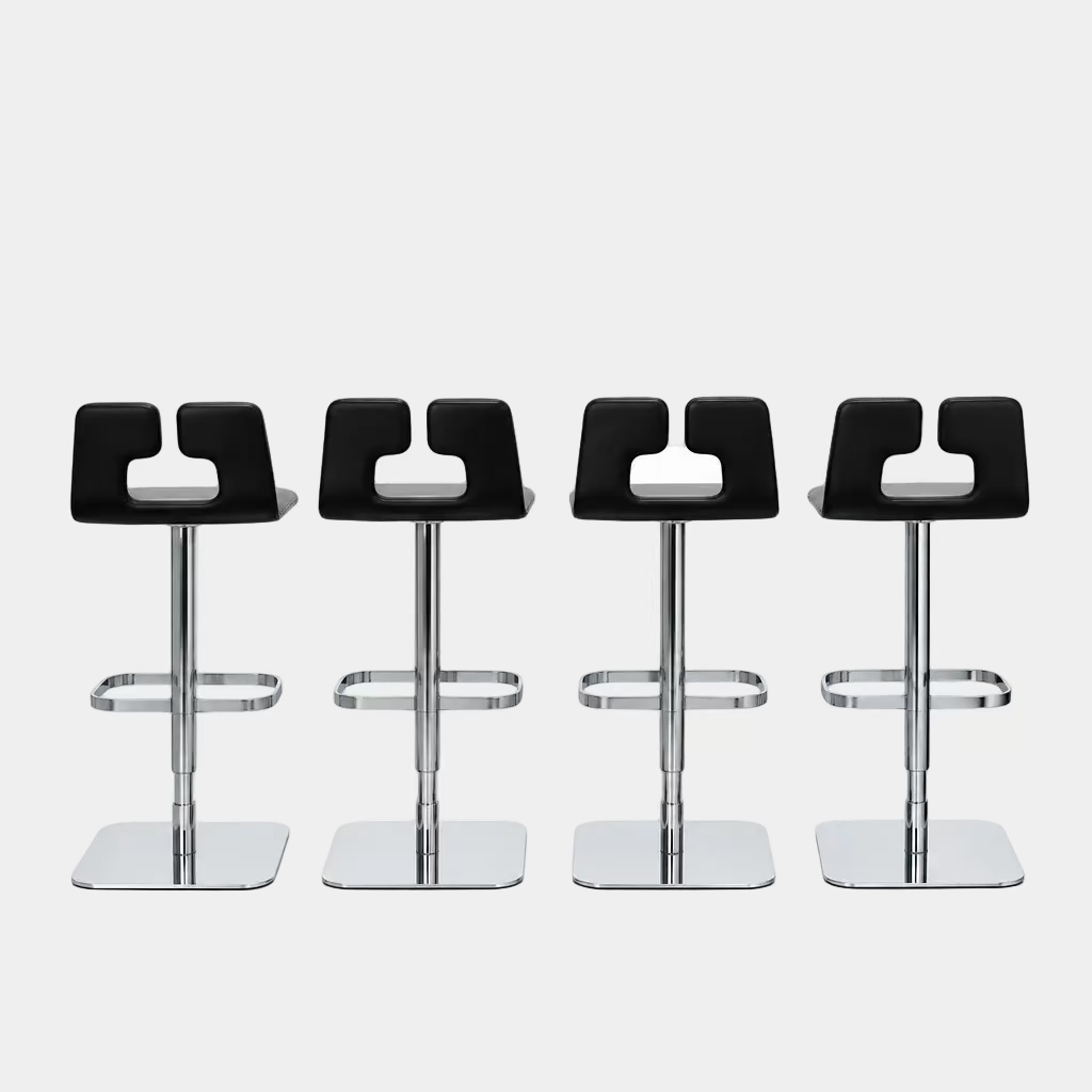 Four Poltrona Frau ALO Revolving Counter Height Adjustable Stools in black leather with chrome bases are arranged in a row, highlighting their modern design against a white background.