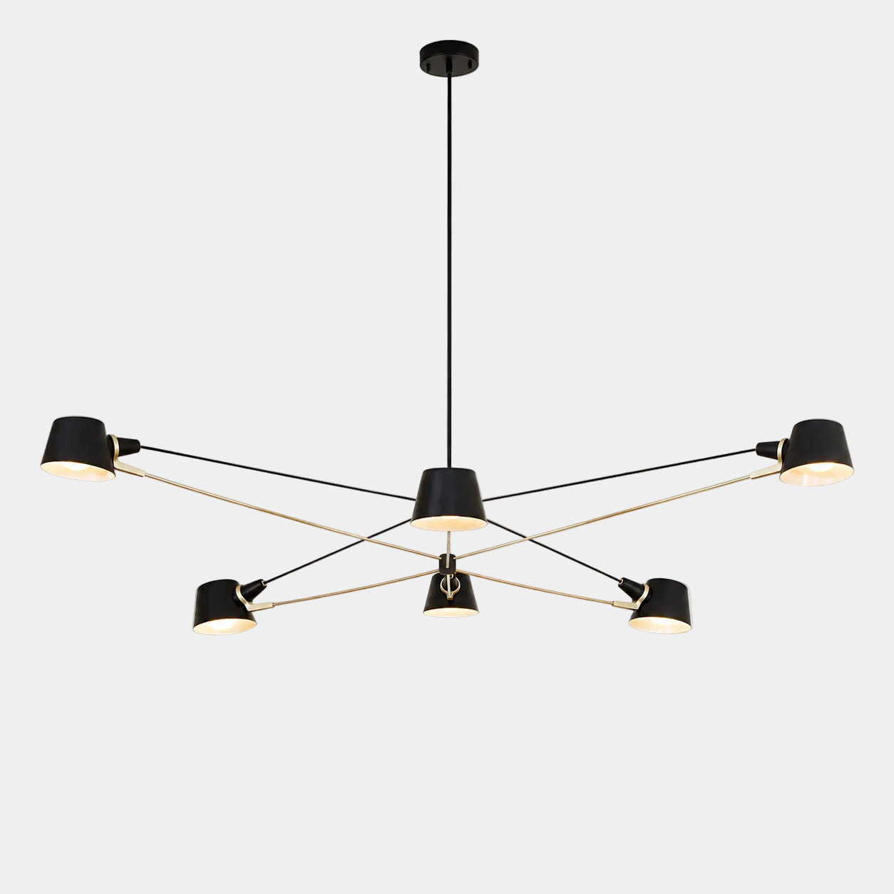 The Pivot chandelier from Ravenhill Studio features six adjustable arms with cone-shaped shades in a modern black finish, suspended against a plain light background to exemplify sculptural lighting characteristic of Ravenhill Studio’s contemporary designs.