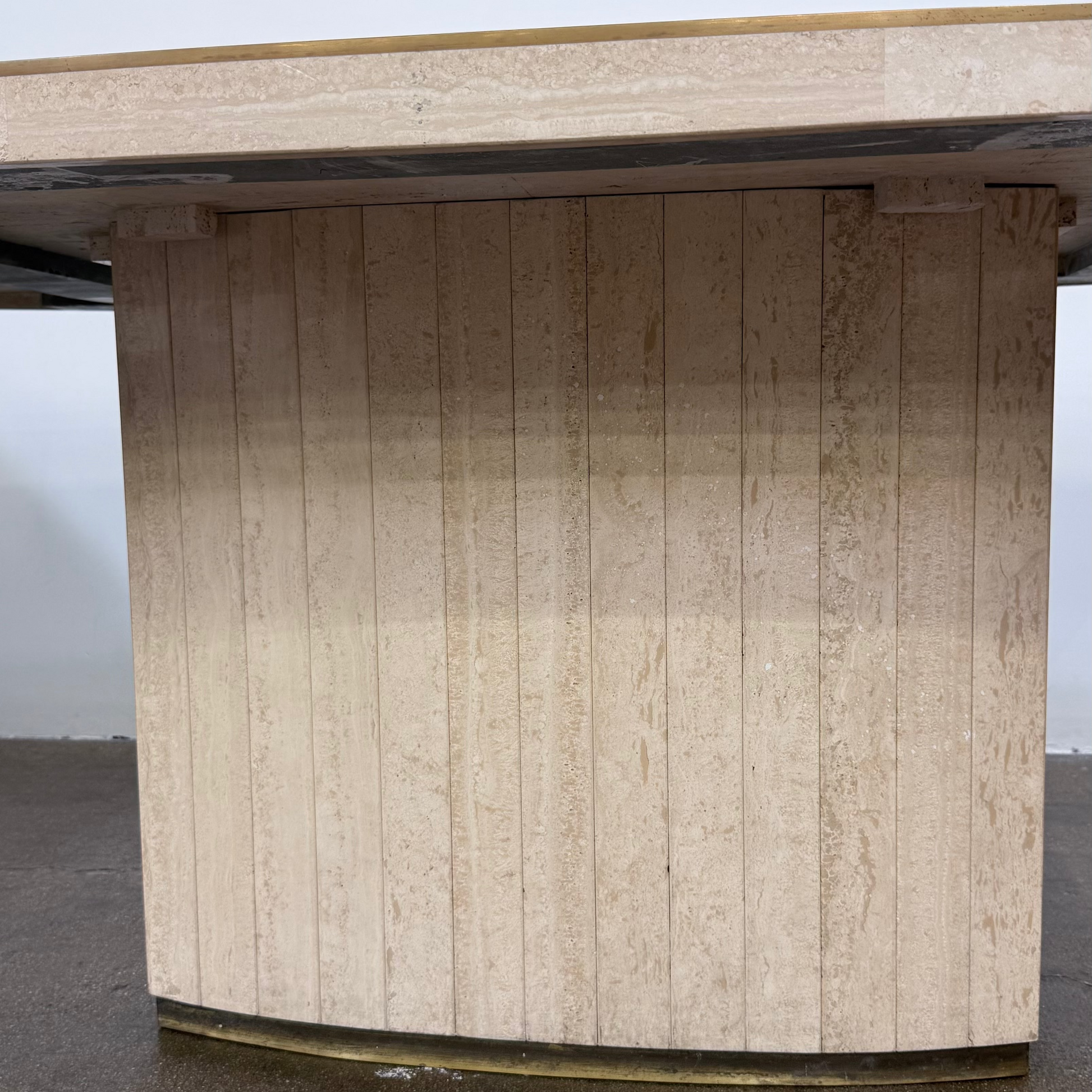 Rectangular Travertine and Brass Dining Table by Willy Rizzo with a brass edge inlay and a central column base.