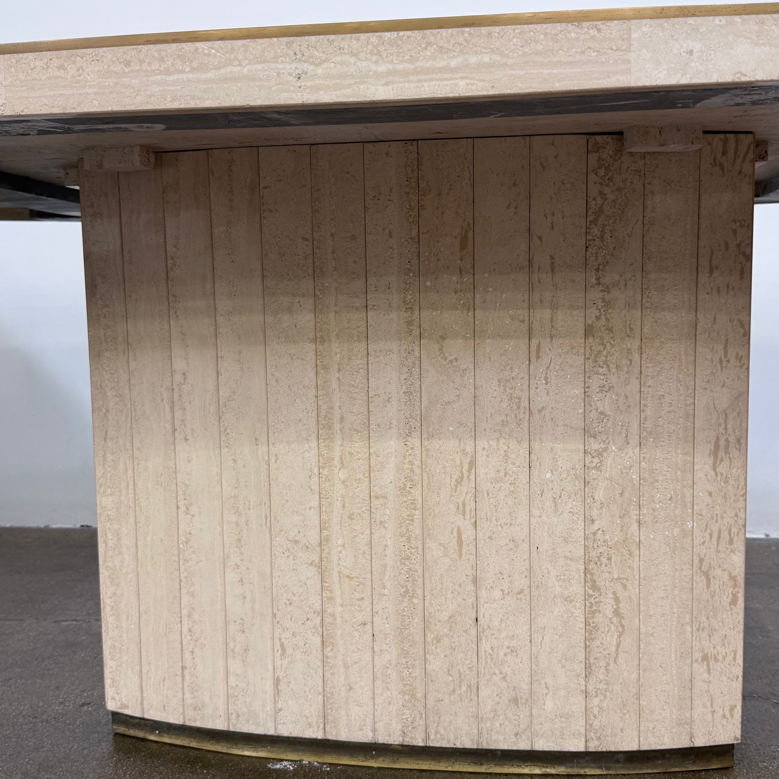 Rectangular Travertine and Brass Dining Table by Willy Rizzo with a brass edge inlay and a central column base.