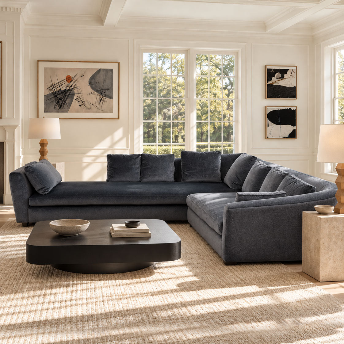 The Minotti Seymour Sectional Sofa by Minotti is a large, L-shaped piece upholstered in luxurious dark gray mohair fabric, featuring five back cushions and an armrest at each end. Its elegant design is showcased against a plain white background.