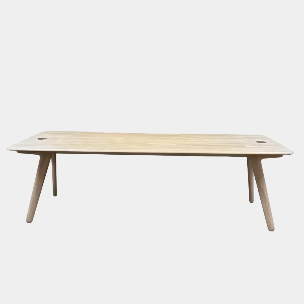 Tom Dixon Slab Desk/Table with cord management featuring a light-colored solid oak slab with rounded corners and circular cord management ports on each end.