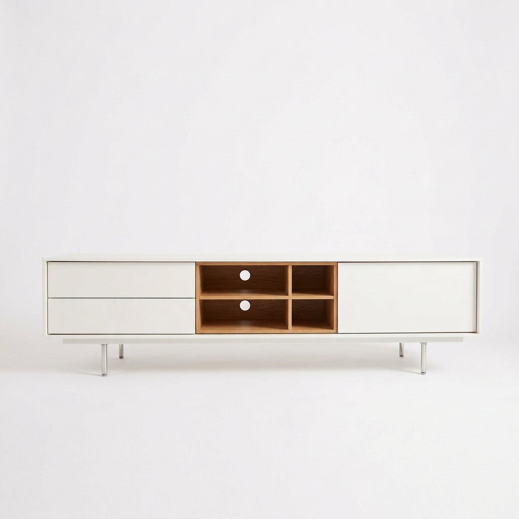 Low-profile white DWR Treku Aura Media Unit on thin legs, featuring two side cabinets and a central open shelf section with a wood-toned interior.