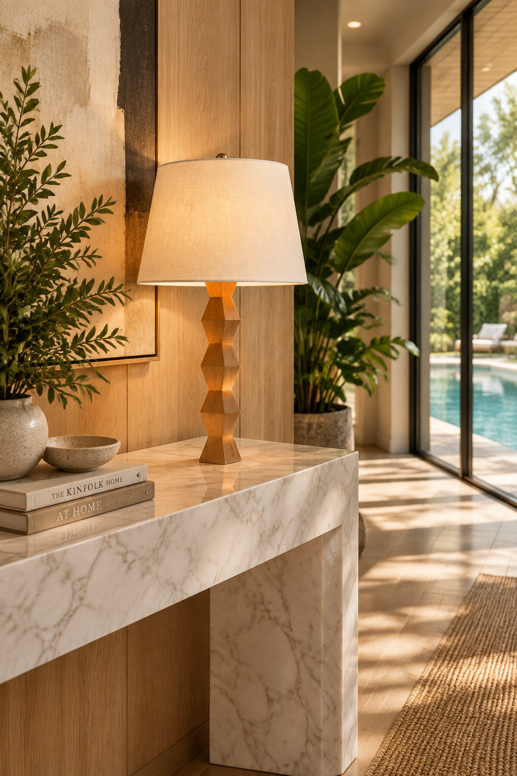 The Donghia Zig Zag Lamp Pickled Oak by Donghia features a white fabric shade and geometric wooden base, displayed on a light wood surface against a plain background.