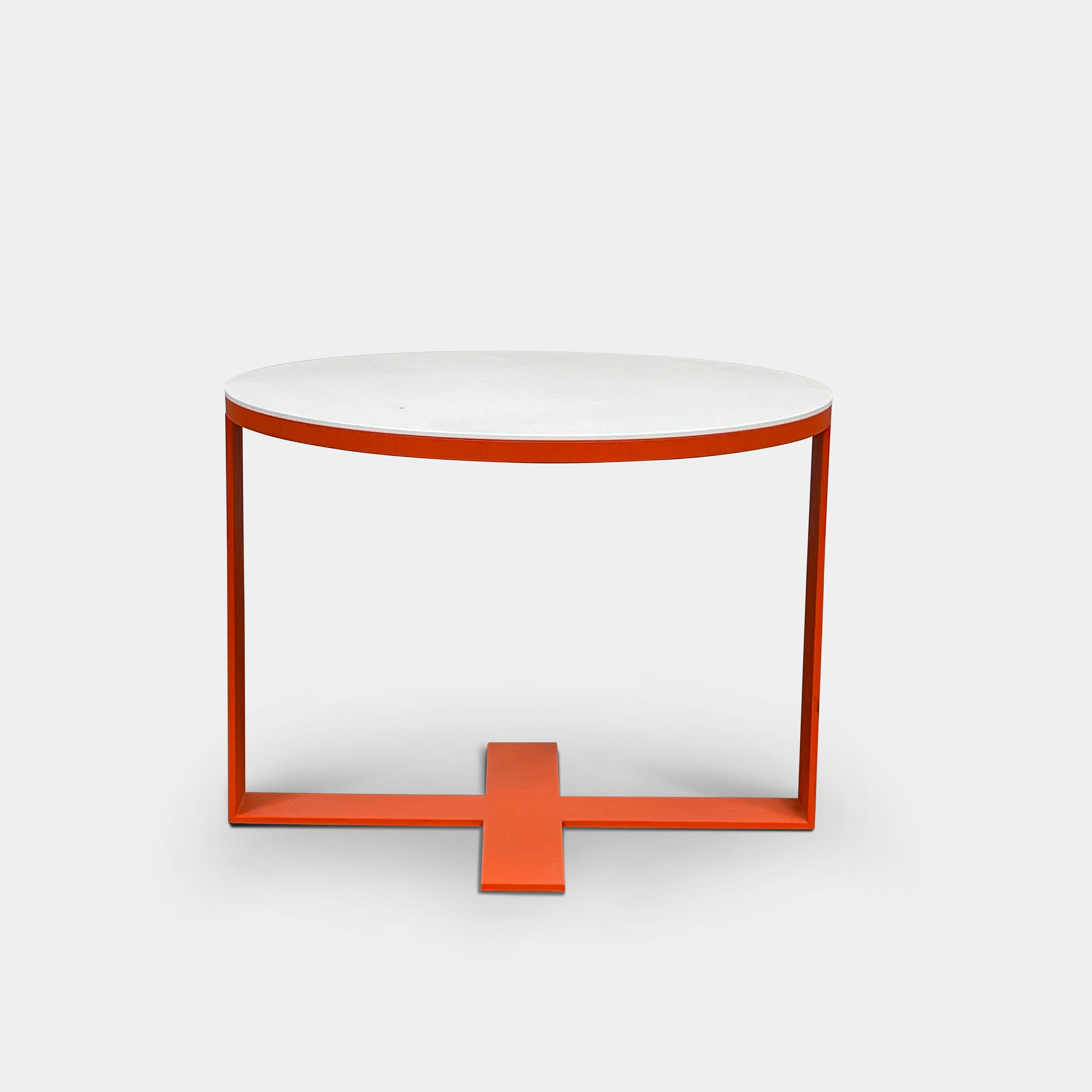 Two modern B&B Italia Eileen tables, featuring white lacquer tops and vibrant orange frames, come in varying heights and unique designs to add a stylish touch to any living space.