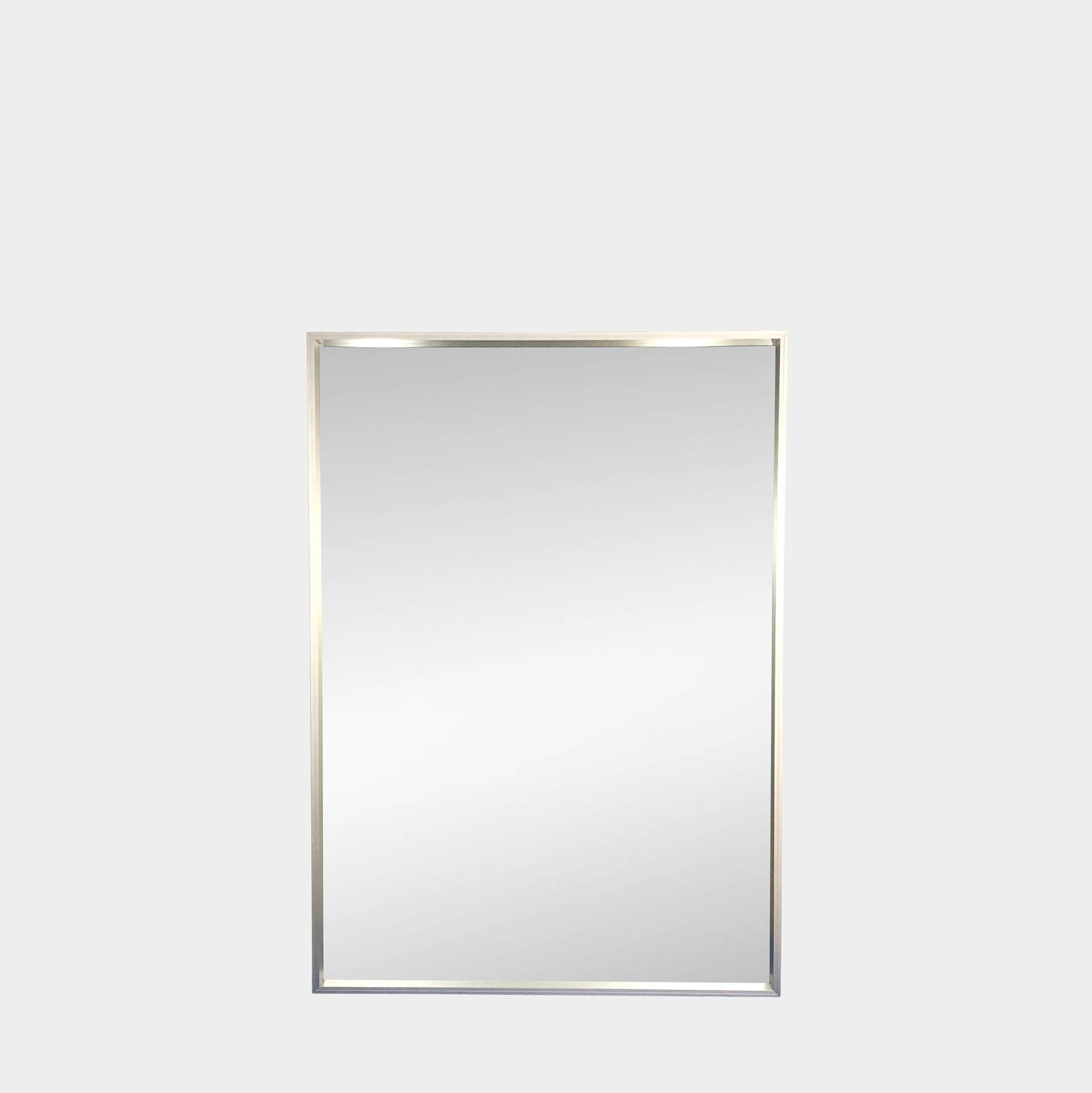 The Bellato Luciano Mirror Large Standing Wall features a sleek, metallic frame and rectangular design, ideal for enhancing space against a simple gray backdrop.