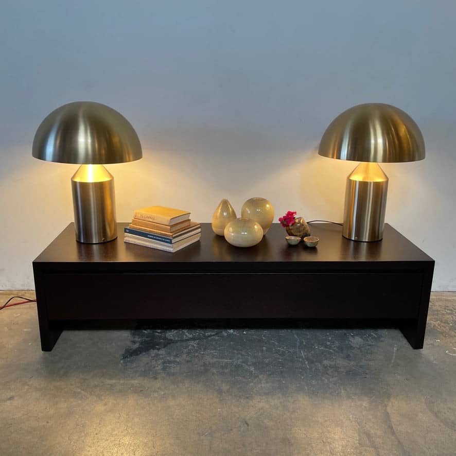 A minimalist Oluce Atolla Metal Table Lamp with a timeless design, showcased on a clean white background.