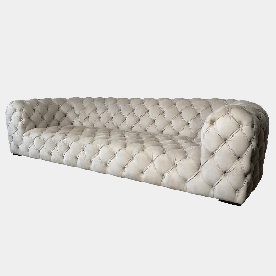 A white Baxter Chester Moon Sofa with a tufted back.
