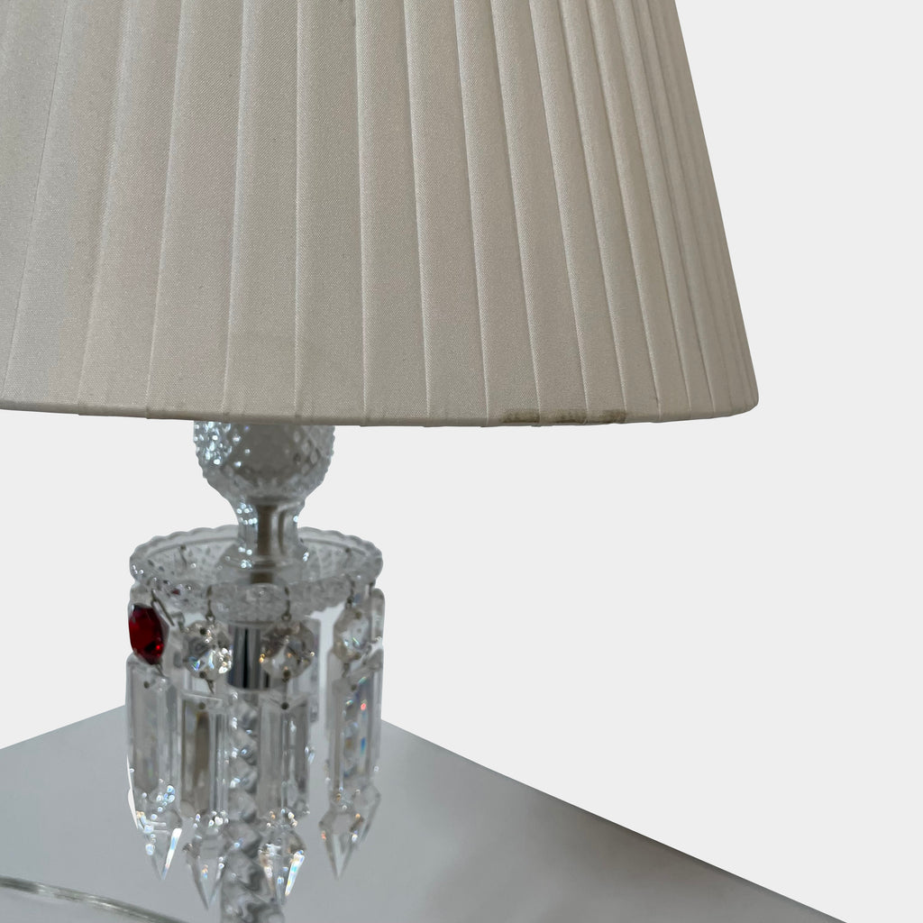 A Baccarat Torch Table Lamp with a crystal base and a white shade.