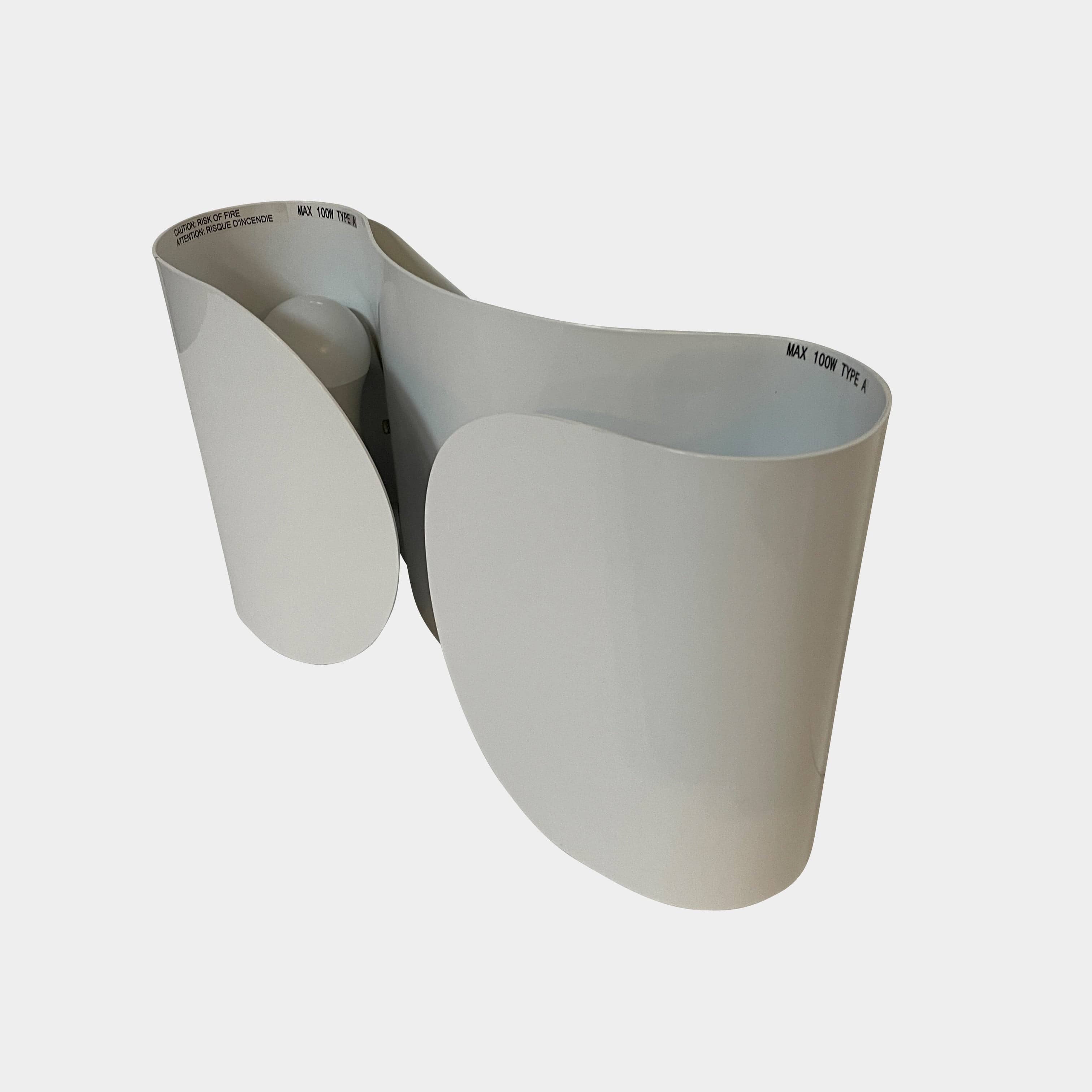 A set of Flos Foglio Wall Sconces emitting indirect light on a steel surface.