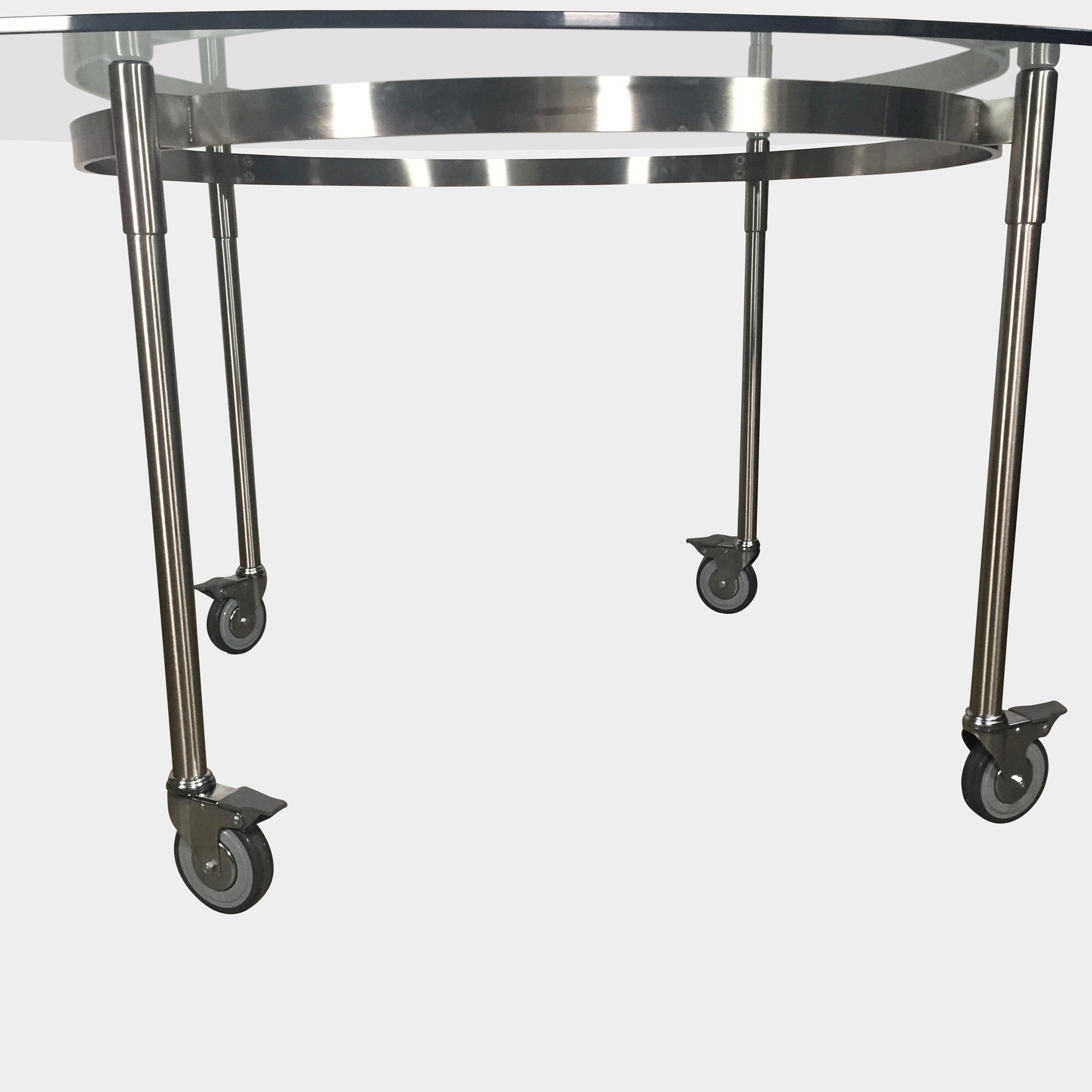 The Driade Ito Dining Table from Driade offers adaptability with its mobile design on wheels, making it easy to move around. It features a chrome base for a sleek and modern look.