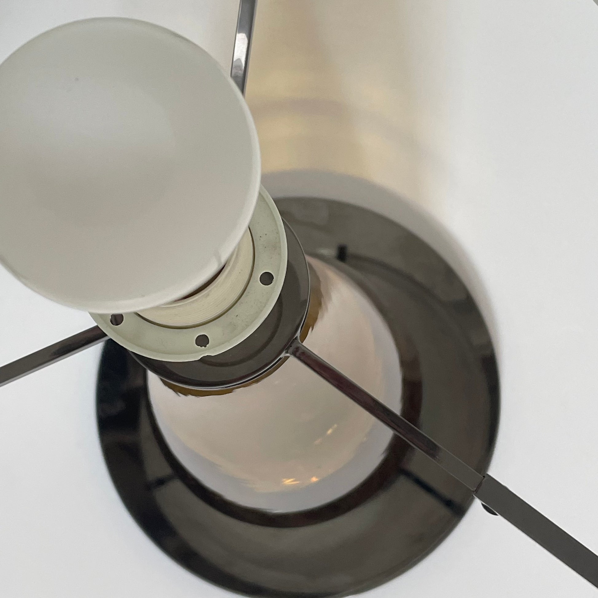 A Venini table lamp with a yellow shade and a black base.