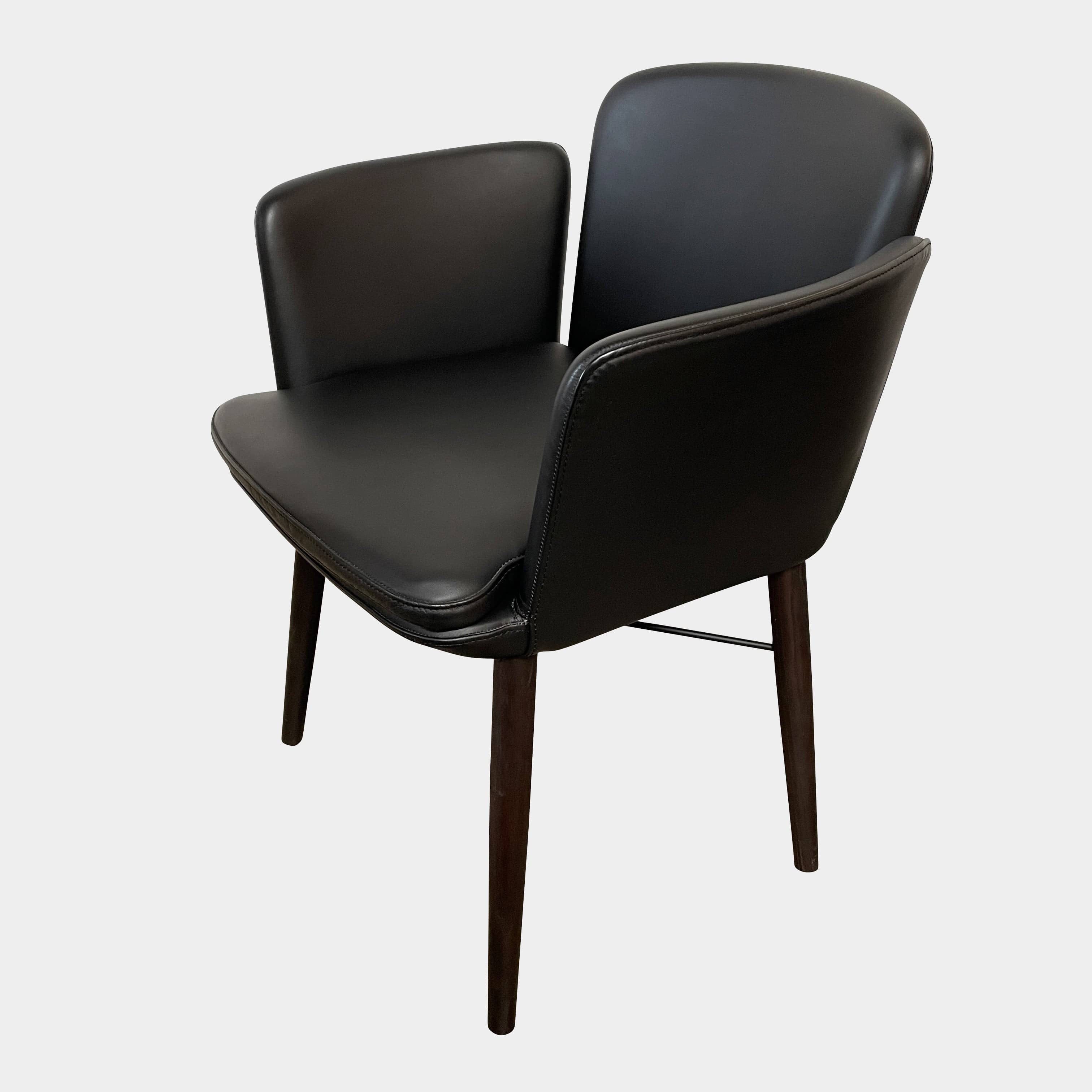 The Lema Tabby Leather Armchair by Lema features a black leather shell, accentuated by dark brown wood legs.