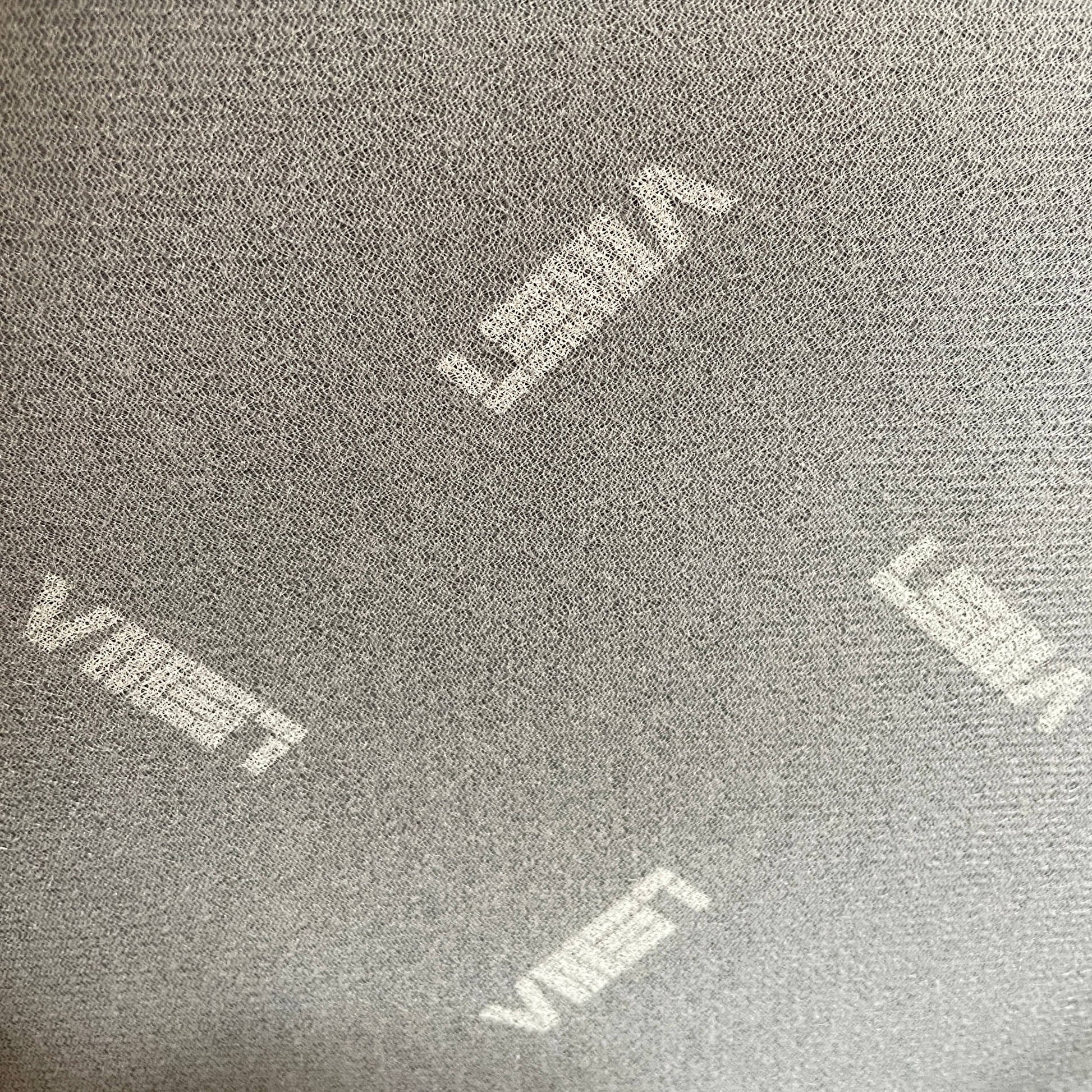 The Lema Tabby Leather Armchair by Lema features a black leather shell, accentuated by dark brown wood legs.