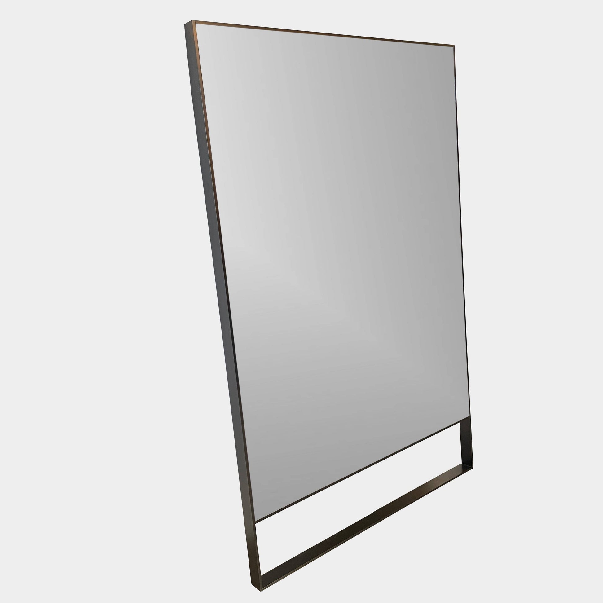 The Maxalto Psiche Leaning Mirror by Maxalto features a large rectangular shape, a slim dark frame, and a minimalist base, shown against a plain white background.