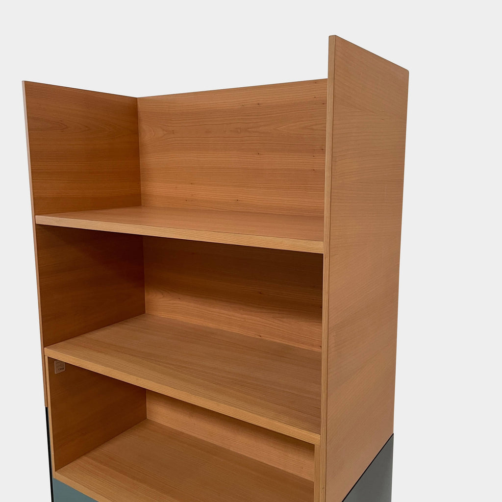 A stable wooden Cinna Hampton bookcase with blue and green shelves.