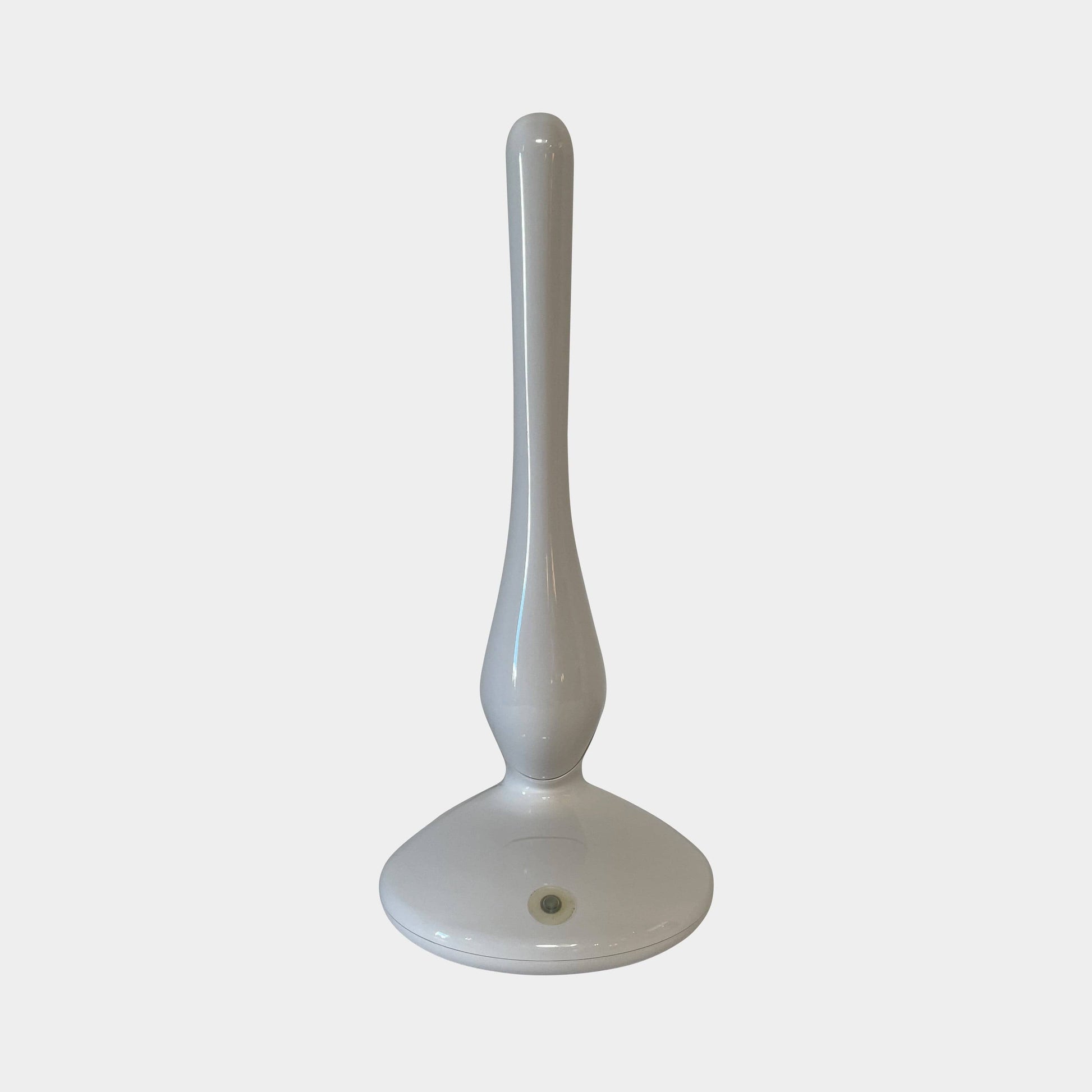 A modern white desk lamp with a curved design and a round base, reminiscent of Ross Lovegrove's aesthetic, akin to the elegance of Yamagiwa Geon Task Lights by Yamagiwa.