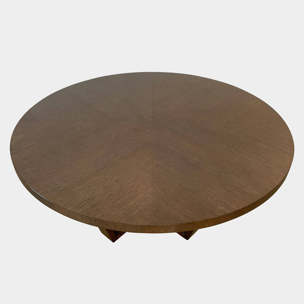 A Maxalto Xilos dining table with a wooden base.