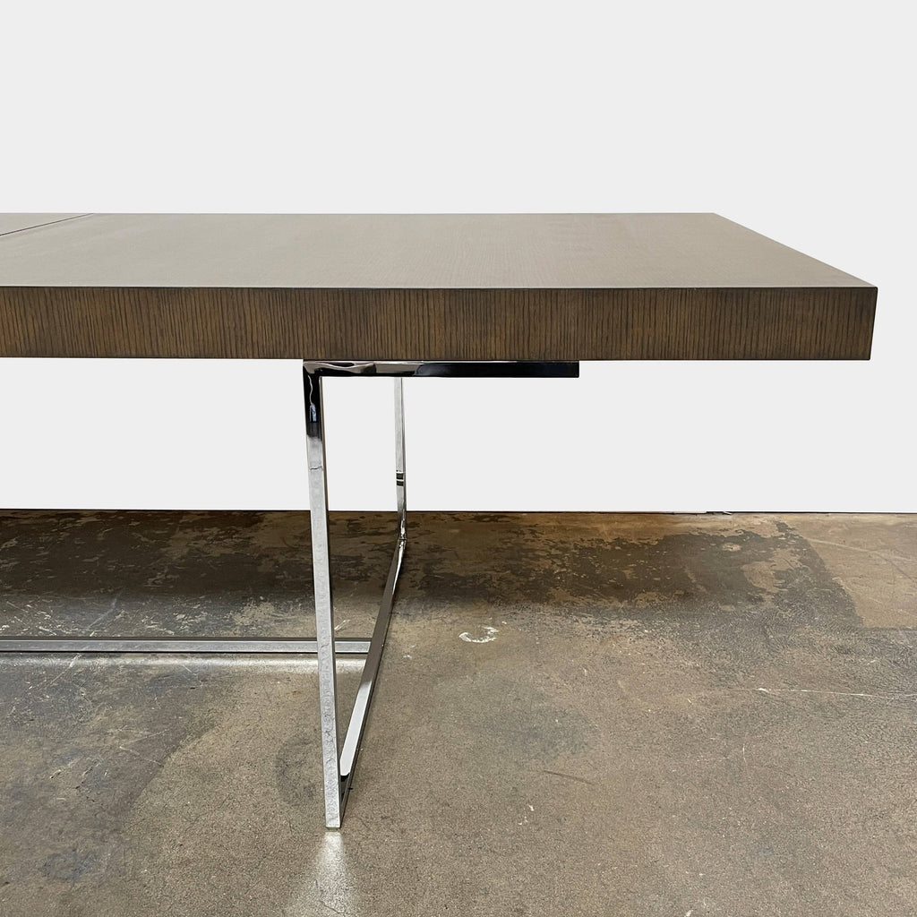 A B&B Italia Athos dining table with metal legs and a black top, bestseller at B&B Italia.