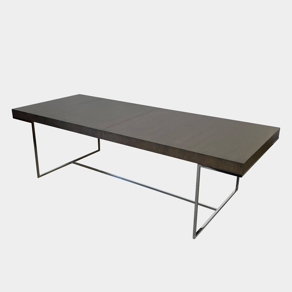 A B&B Italia Athos dining table with metal legs and a black top, bestseller at B&B Italia.