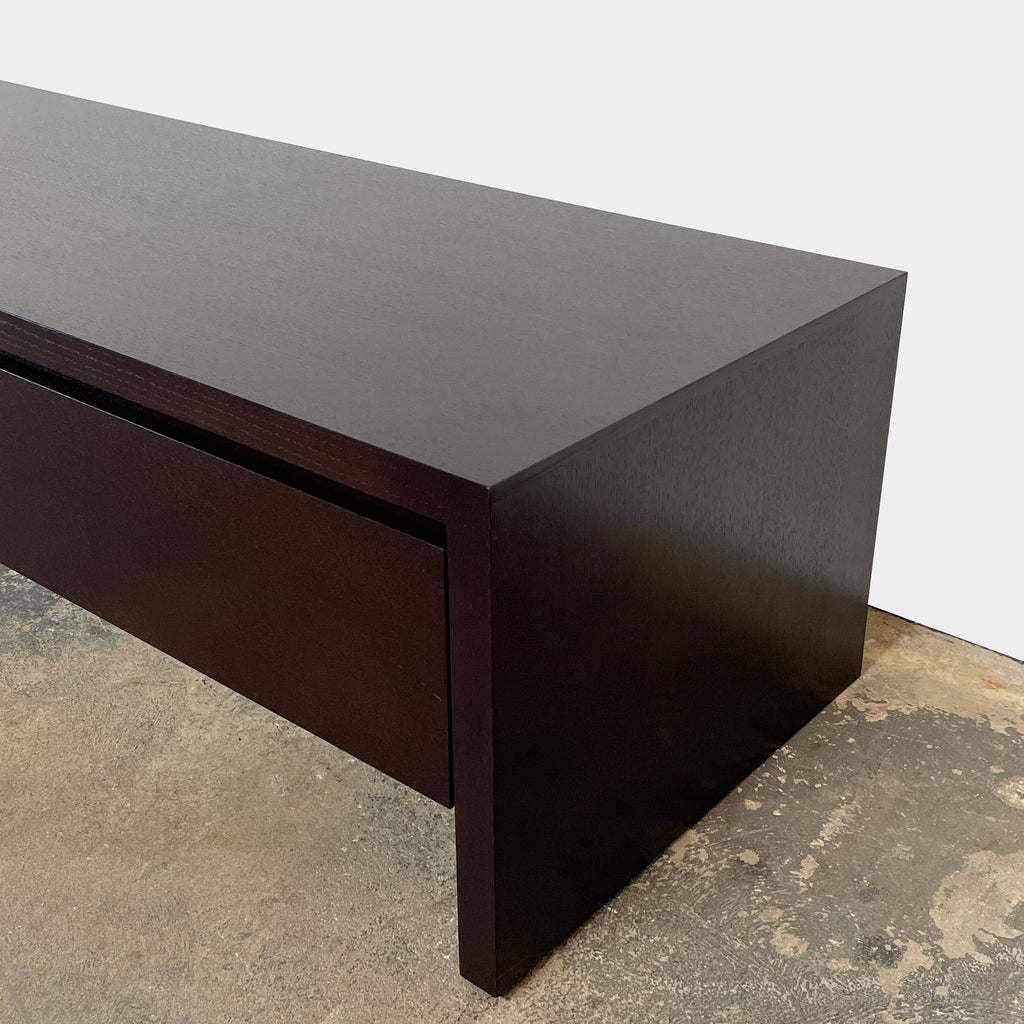 A dark brown Maxalto Low Console With Large Drawer on a white background.