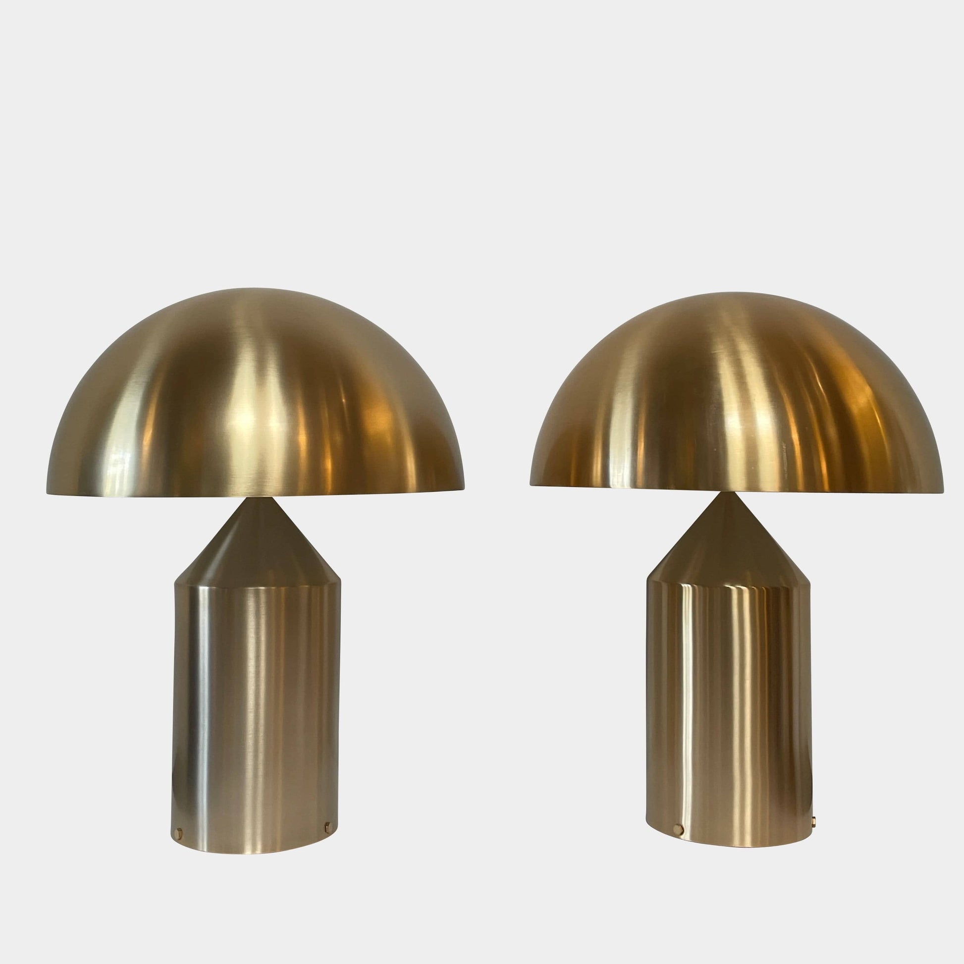 A minimalist Oluce Atolla Metal Table Lamp with a timeless design, showcased on a clean white background.