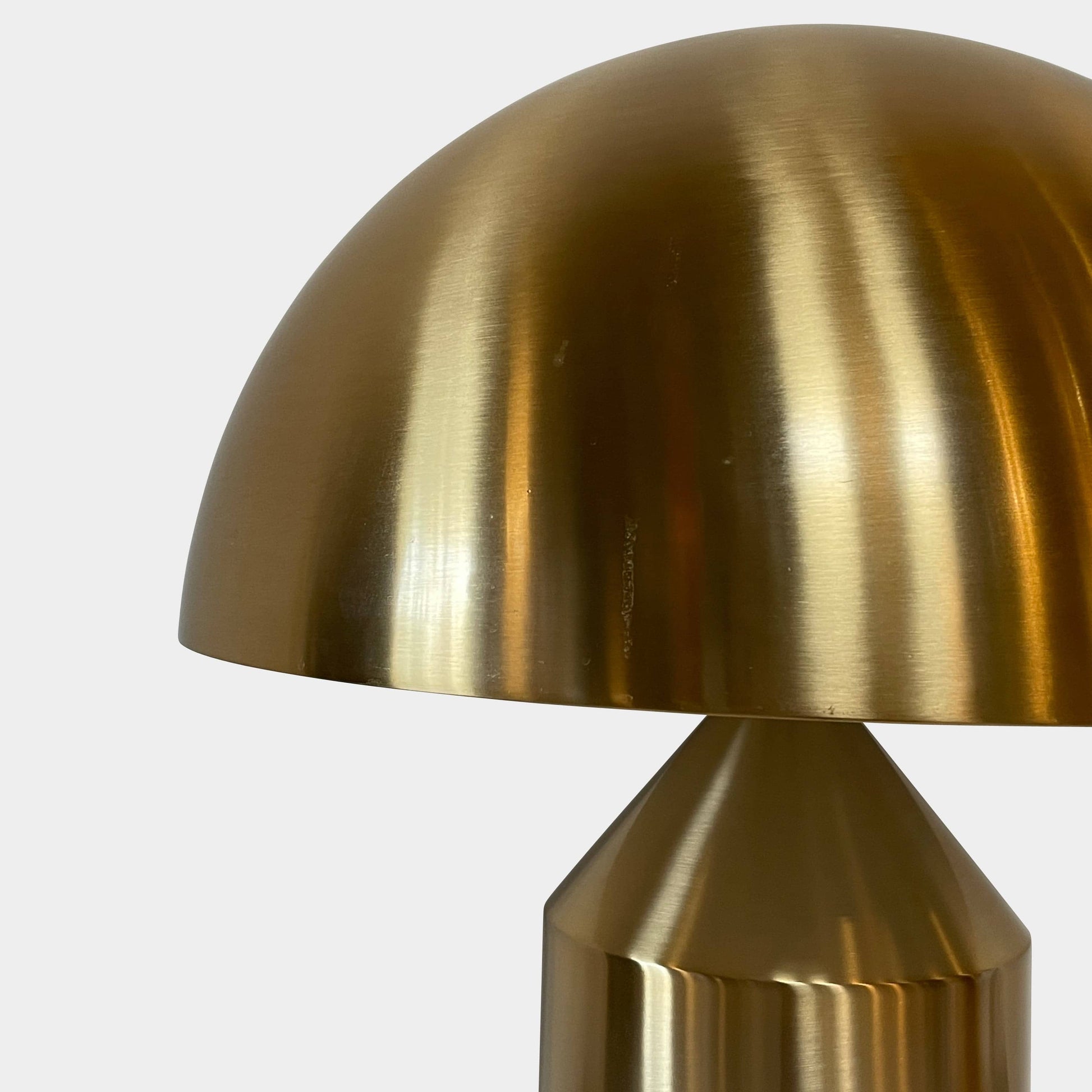 A minimalist Oluce Atolla Metal Table Lamp with a timeless design, showcased on a clean white background.