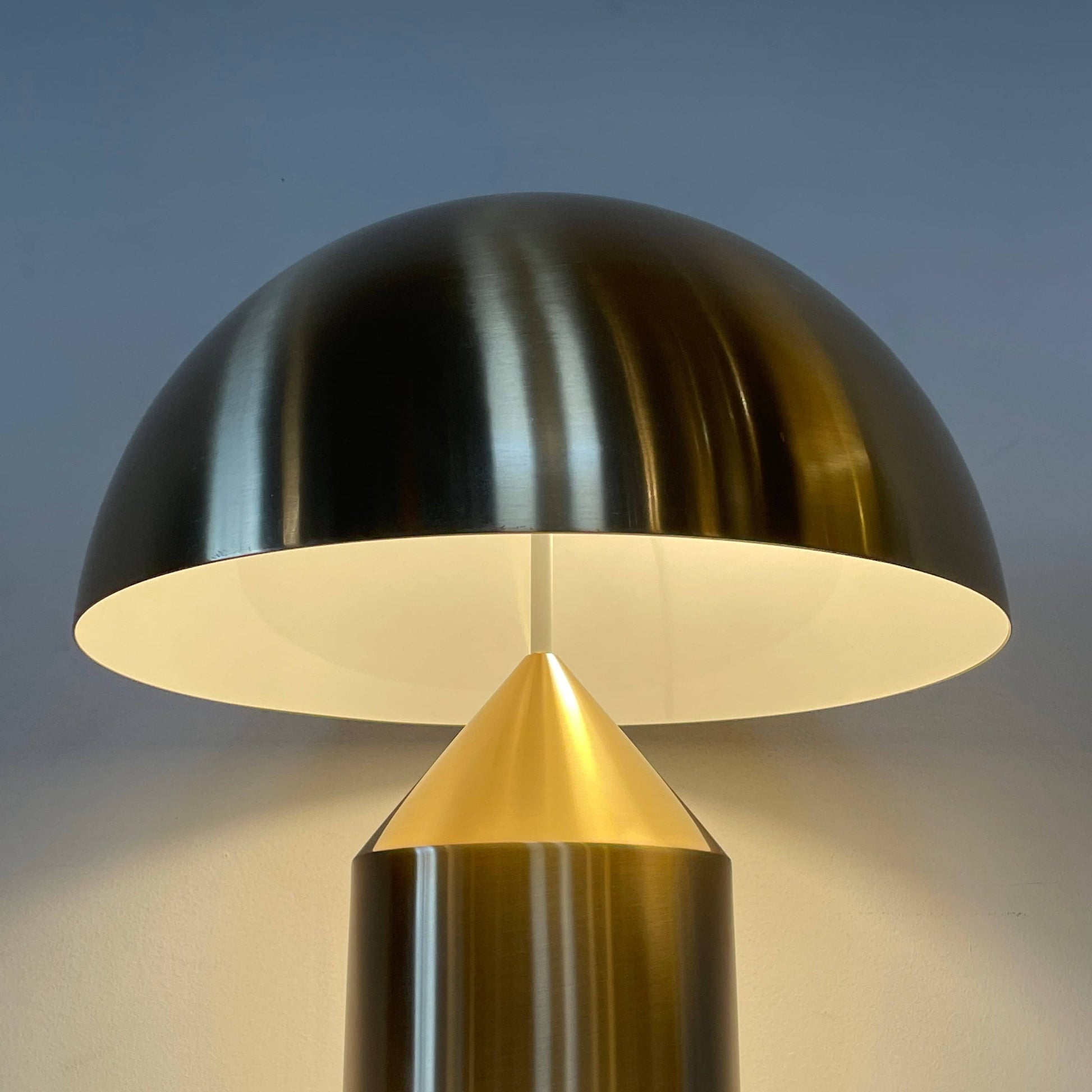 A minimalist Oluce Atolla Metal Table Lamp with a timeless design, showcased on a clean white background.