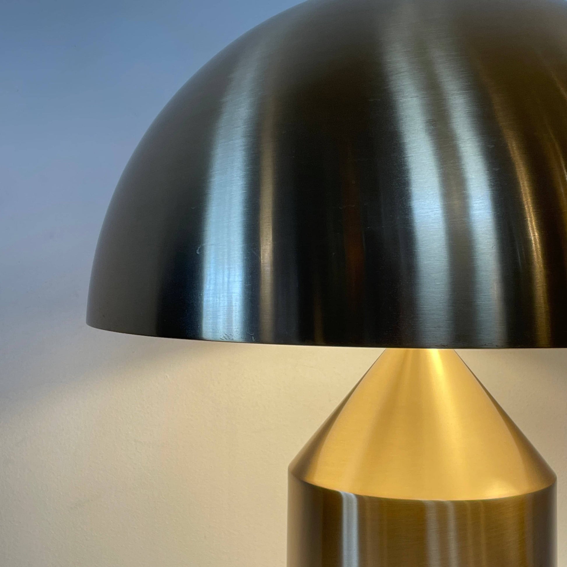 A minimalist Oluce Atolla Metal Table Lamp with a timeless design, showcased on a clean white background.