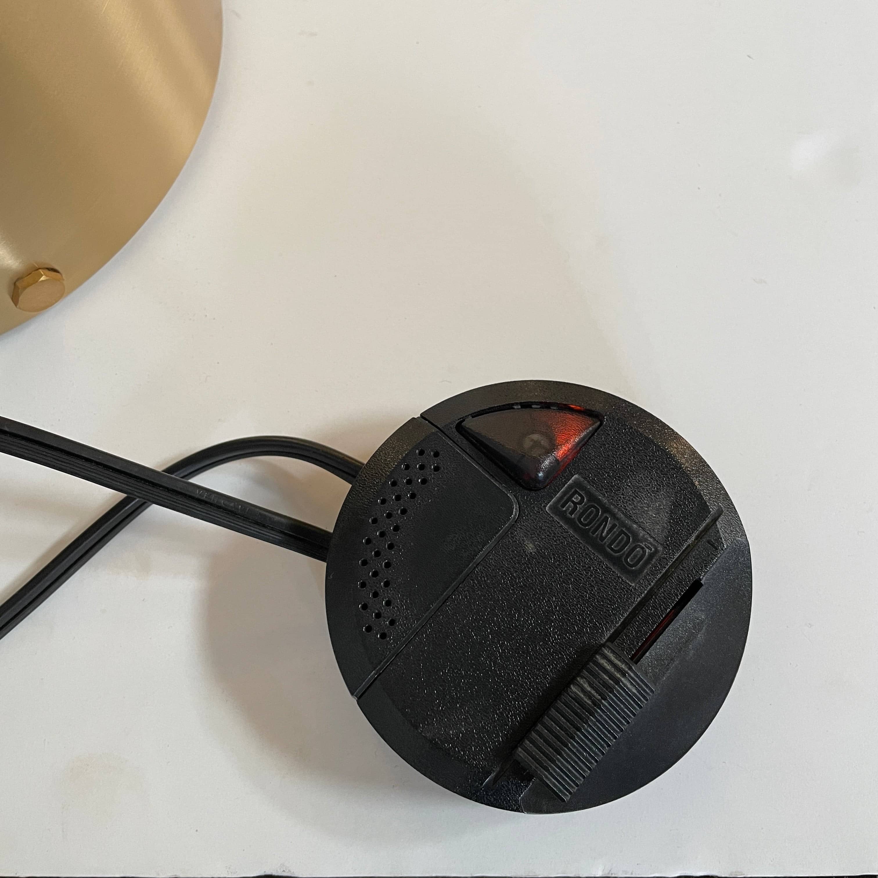 A minimalist Oluce Atolla Metal Table Lamp with a timeless design, showcased on a clean white background.