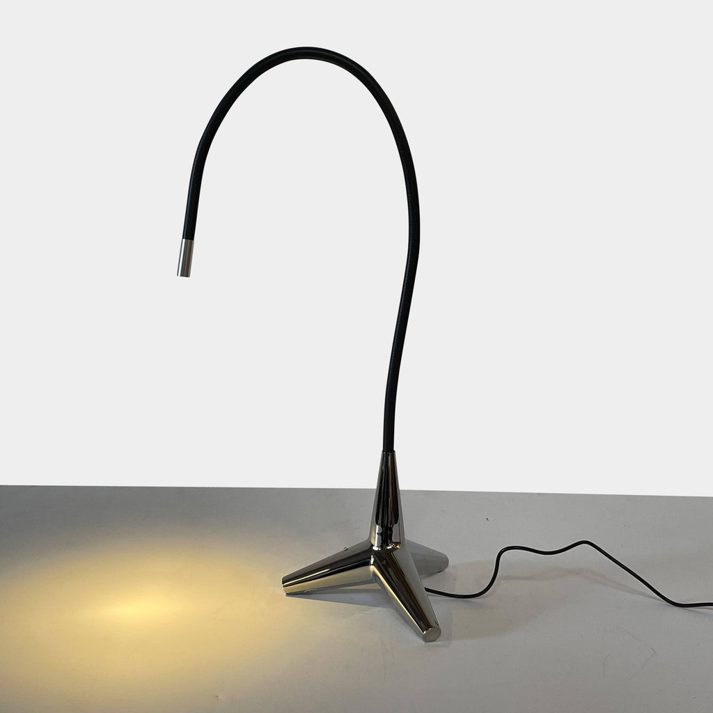 The Yamagiwa Stem Ray Table Light by Yamagiwa, a modern style table lamp, features a sleek black design with a coordinating black cord.