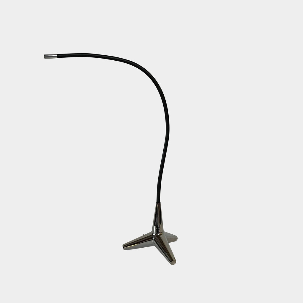 The Yamagiwa Stem Ray Table Light by Yamagiwa, a modern style table lamp, features a sleek black design with a coordinating black cord.