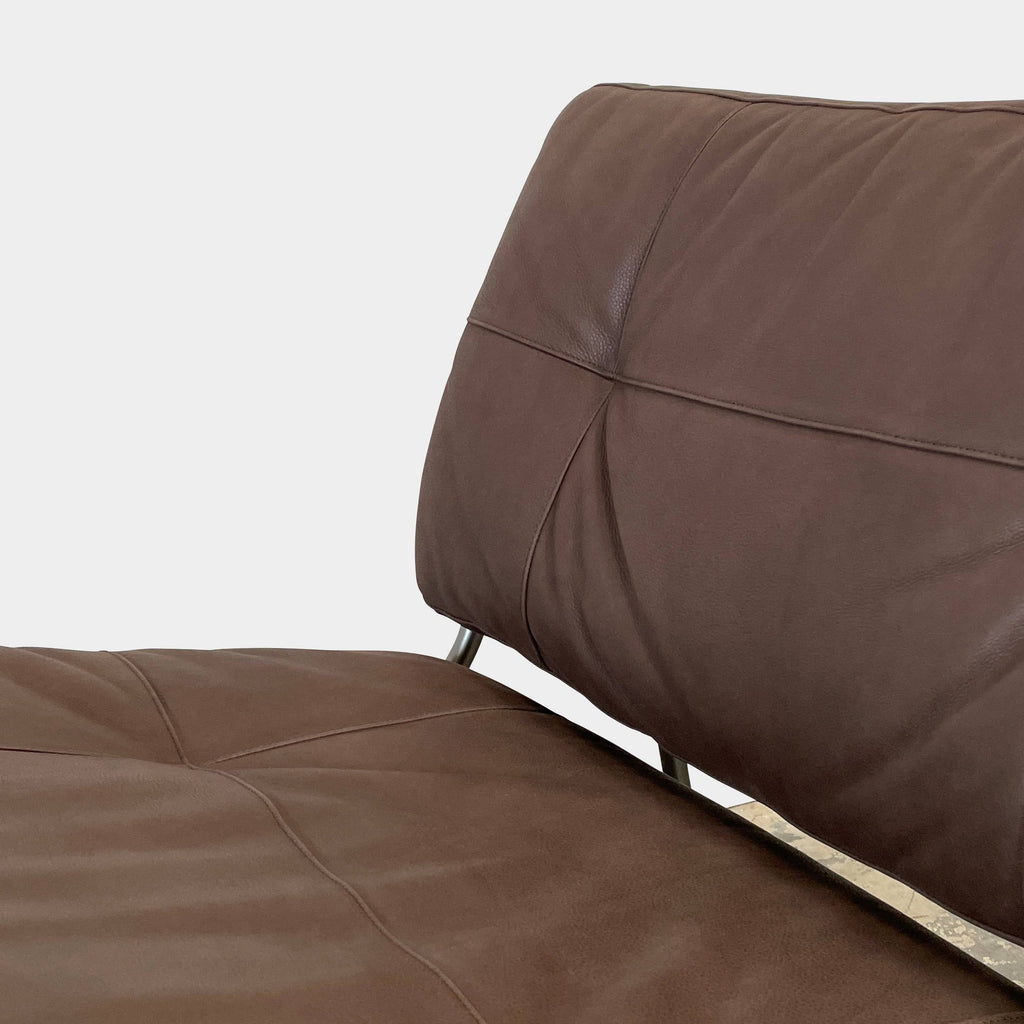 The Living Divani Frog Lounge Chair by Living Divani features soft brown leather upholstery on a sleek metal frame.
