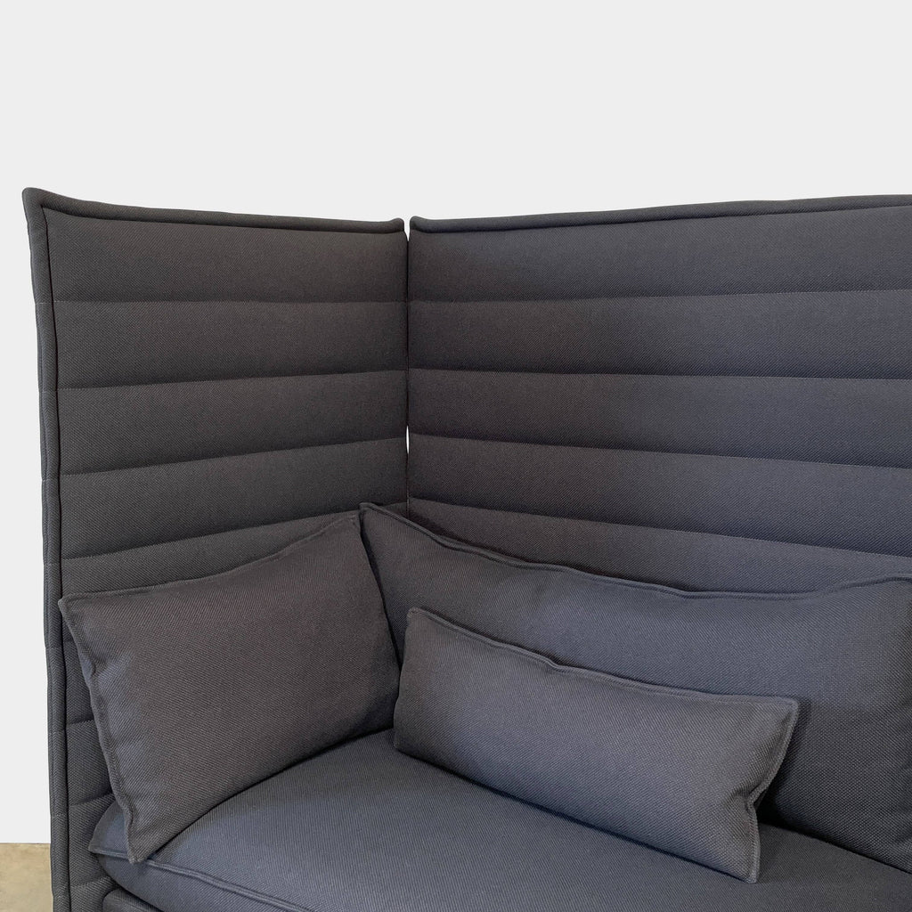 The Vitra Alcove Sofa by Vitra provides comfortable seating with its black cushions and frame.
